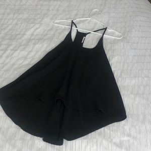 Black spaghetti strap light weight top that is longer in the back